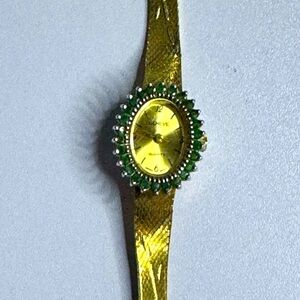 Estate Geneva Gold and Green Emerald Dial Watch Elegant Design no battery.
